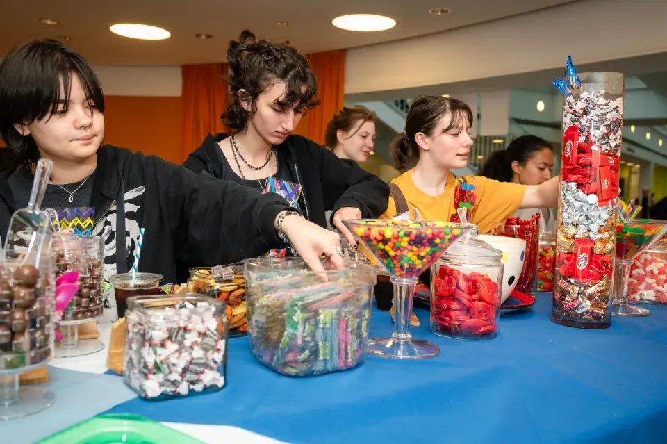 Students enjoy a candy bar